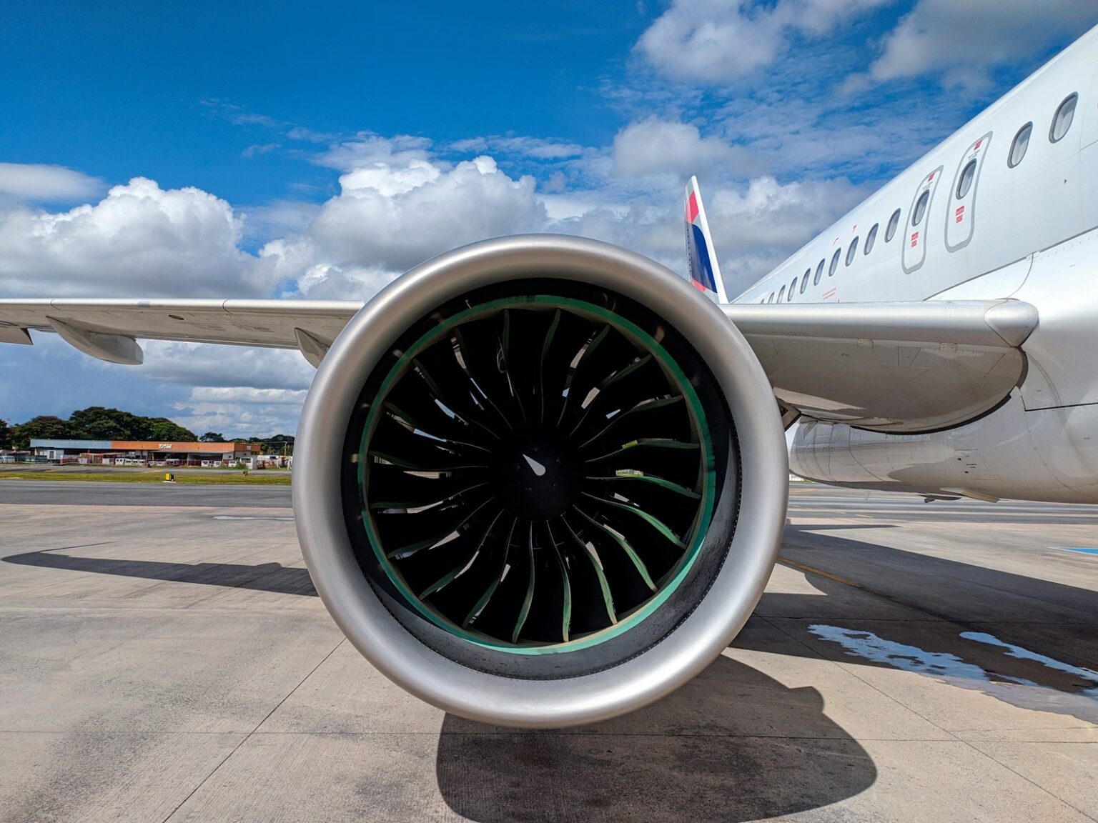 a large jetliner sitting on top of an airport tarmac